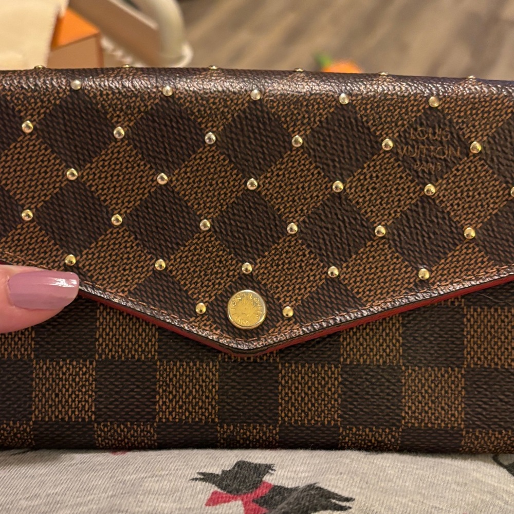 Louis Vuitton studded long wallet. COA provided.